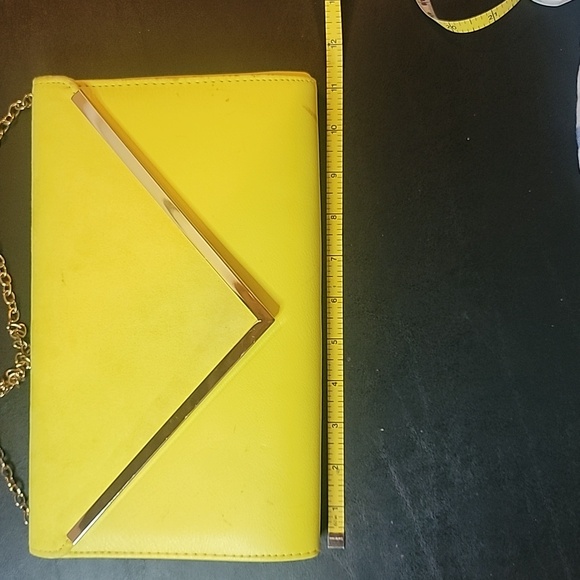Aldo Yellow Clutch some spots.  Has a snap closure and chain shoulder strap - Picture 2 of 8